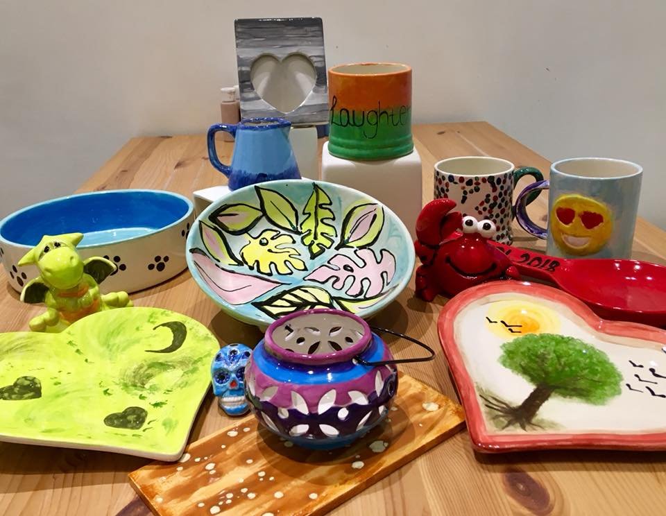 Colorful pottery on a wooden table