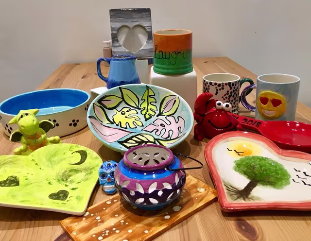 Colorful pottery on a wooden table