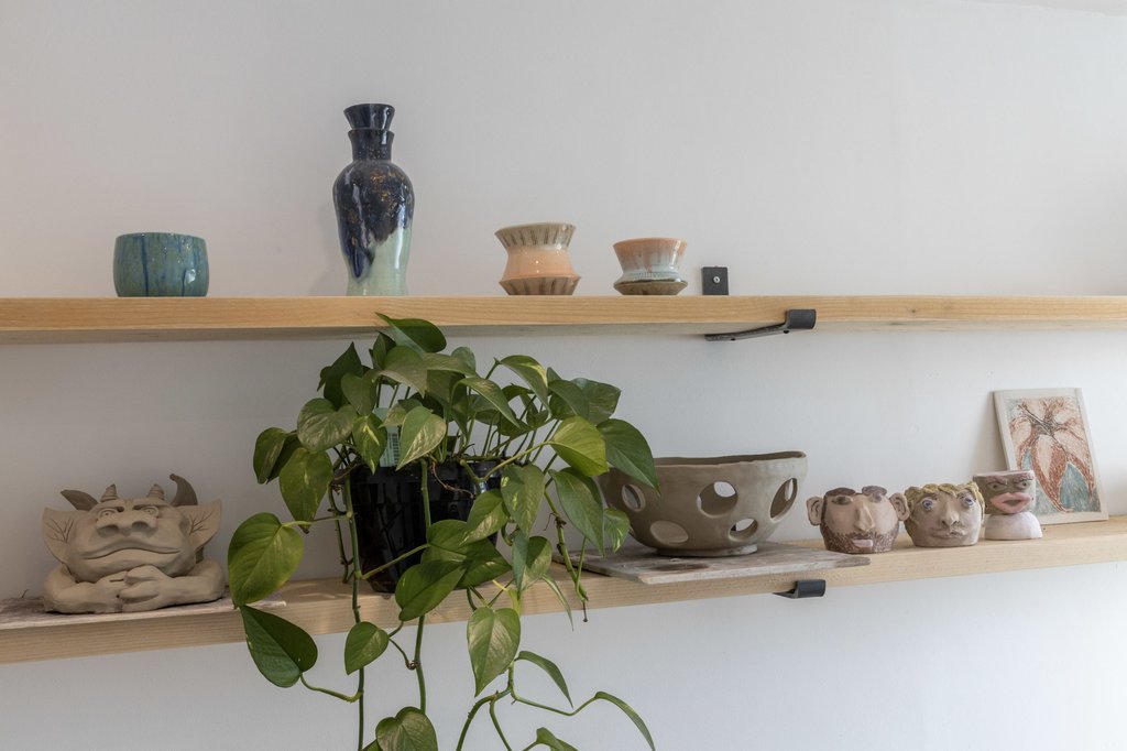 Shelved pottery and plants