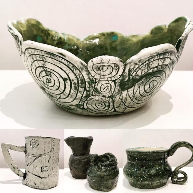 Ceramic vessels with varying shapes and colors.