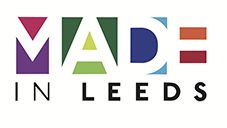Colorful block lettering spells out 'MADE IN LEEDS'. Each letter has a different vibrant color and geometric pattern.